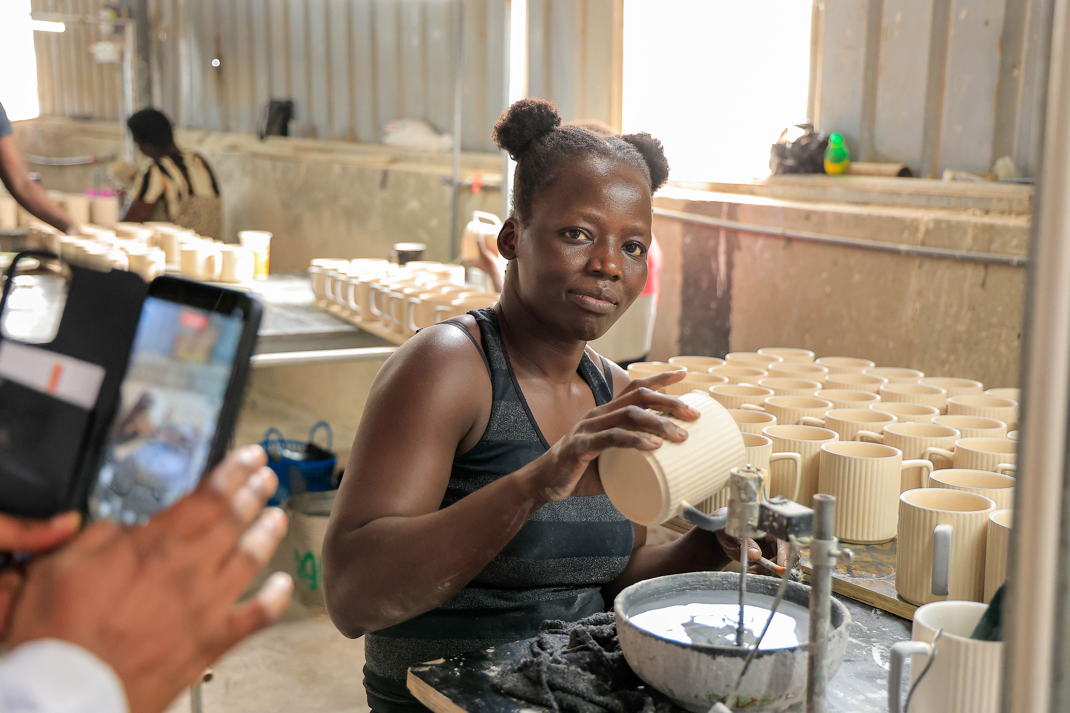 A factory worker handling one of the many products produced here in Uganda