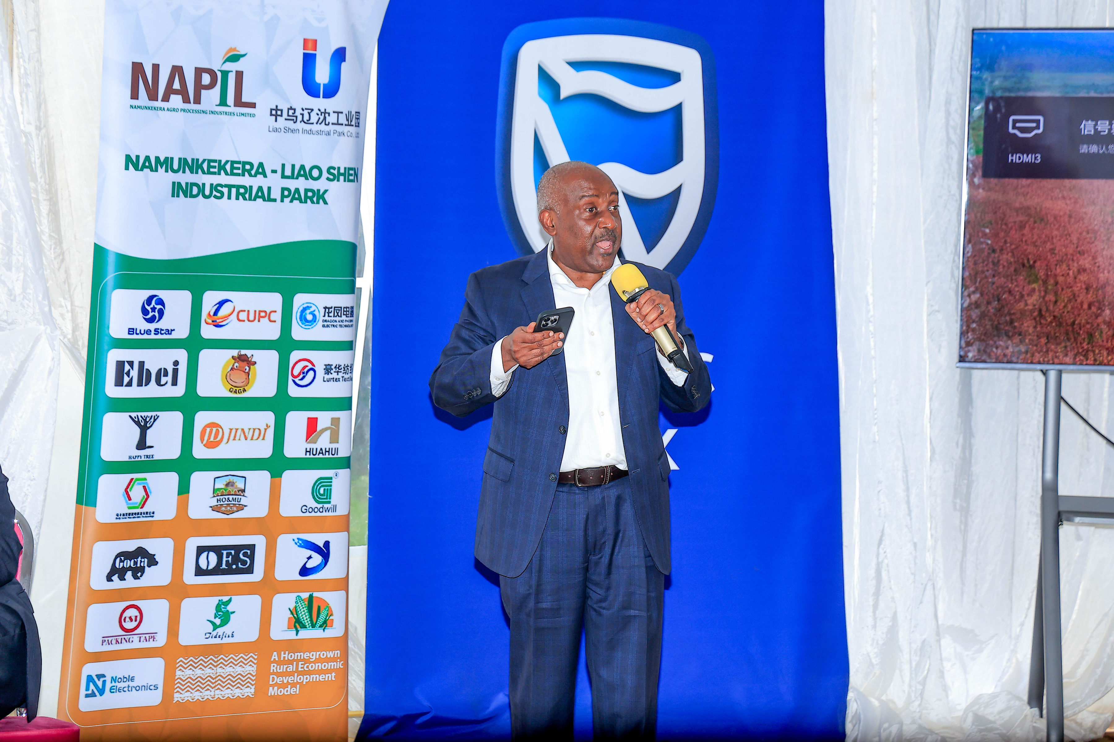 PCF Board Chairman, Emmnauel Katongole addressing the congregation at the Information Tour at Kapeeka Industrial Park